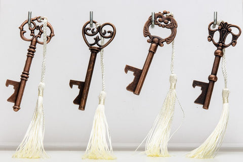 apribottiglia chiave bronzo con nappina avorio